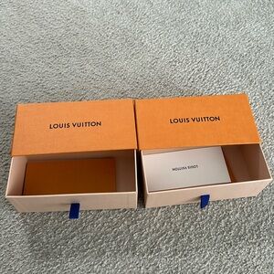 2 Louis Vuitton sunglass boxes.